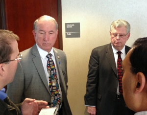 San Bernardino Mayor Patrick Morris, left, and City Attorney James Penman talk to reporters