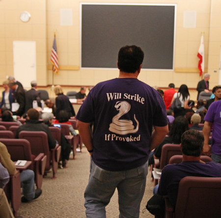 One of several strike warning shirts and jackets at panel hearing (San Jose Mercury-News photo)